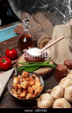 yogurt, garlic , tomato on the table Stock Photo