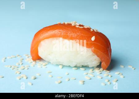 Sushi roll on blue background, close up. Japanese food Stock Photo