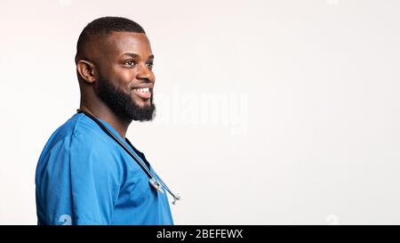 Side view of positive african american young doctor Stock Photo