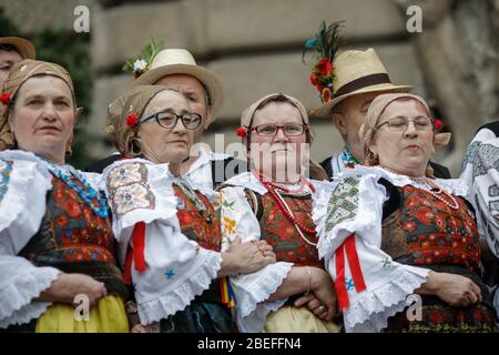 Bucharest, Romania - March 5, 2020: Senior women and men dressed in Romanian traditional clothing at a festival. Stock Photo