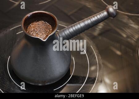 Karamic Turk with coffee on an electric stove Stock Photo