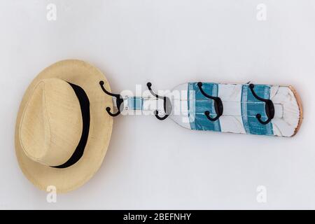 Hat on a hanger. Conceptual composition. Close up. Stock Photo