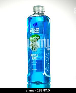 Radox muscle soak bottle studio shot photographed on a white background with reflection. Stock Photo