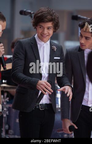 Harry Styles of One Direction performs on NBC's 'Today' at Rockefeller Plaza on November 13, 2012 in New York City. Stock Photo