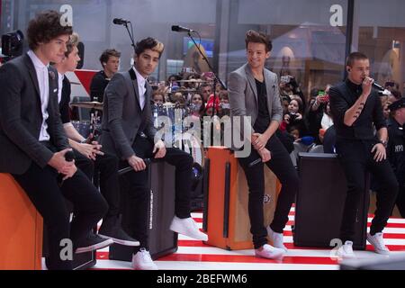 One Direction performs on NBC's 'Today' at Rockefeller Plaza on November 13, 2012 in New York City. (l to r:) Harry Styles; Niall Horan; Zayn Malik; L Stock Photo