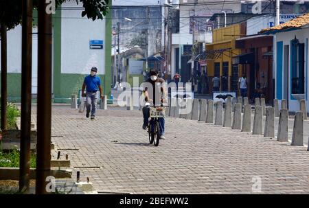 Guacara, Carabobo, Venezuela. 13th Apr, 2020. April 13, 2020. A man travels by bicycle in the streets of the central town of Guacara, Carabobo state. Photo: Juan Carlos Hernandez Credit: Juan Carlos Hernandez/ZUMA Wire/Alamy Live News Stock Photo