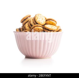 Mini cream sandwich cookies in bowl isolated on white background. Stock Photo