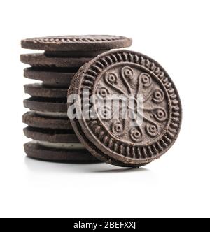 Dark cream sandwich cookies isolated on white background. Stock Photo