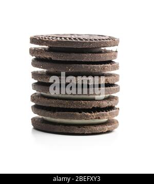 Dark cream sandwich cookies isolated on white background. Stock Photo