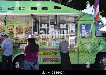 LOS ANGELES, CA/USA - OCTOBER 25, 2019: Customers in line at a food truck specializing in Puerto Rican food at an art festival Stock Photo