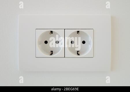 The socket twin double white EU standard with grounding. Stock Photo