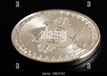 Bitcoin on black background. Cryptocurrency trading. Macro photo Stock Photo
