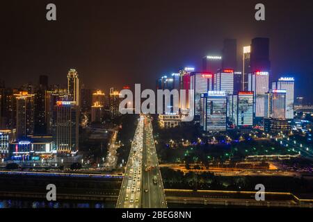 Dec 22, 2019 - Chongqing, China: Aerial night view of Huanghuayuan bridge to Jiang Bei District Stock Photo