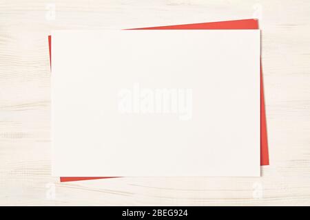 White empty blank paper on wood background. Top view. Stock Photo