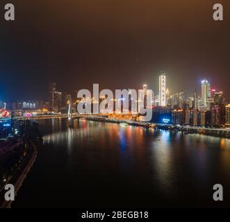 Dec 22, 2019 - Chongqing, China: Aerial night view of Hong Ya Dong cave by Jialing river Stock Photo