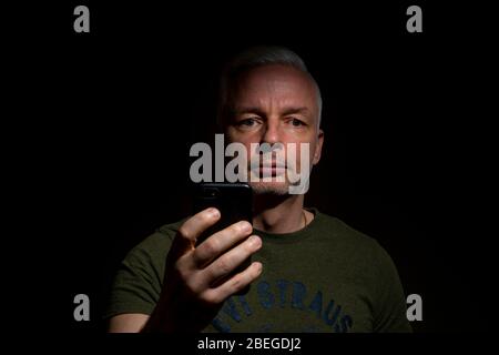 Dramatic closeup shot of white male with one flash setup Stock Photo