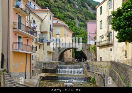 A small river flows through the town of Campagna, in the province of Salerno, Italy Stock Photo
