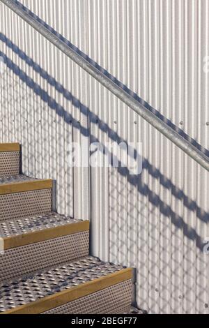 Abstract image of metal stairs with morning shadows in Steveston British Columbia Stock Photo