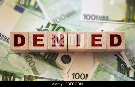 Denied word written on wood block. Claim denied financial concept Stock Photo