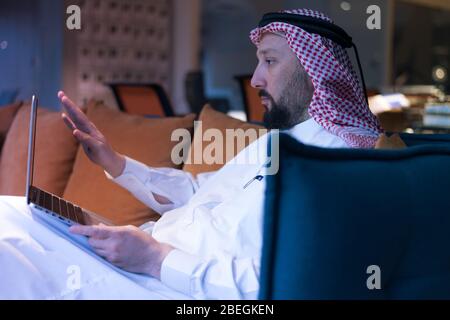 Middle Eastern businessman typing on the phone in his office. Businessman Arabic using mobile phone for connection to communication.Business Technolog Stock Photo