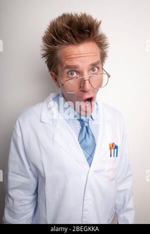 Quack doctor with crazy expression to match his hair looking at the camera like he's got something to say Stock Photo