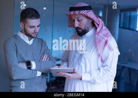 Arab Businessman talking with American Businessman.  Confirmation of Business alliance Partners as WELL. Adhering Respect, Commitment and Integrity in Stock Photo