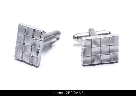 Pair of stylish grey metal cufflinks isolated on the white background Stock Photo