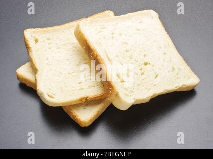 Three fresh rusks isolated on the grey background Stock Photo