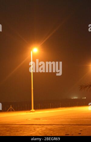 Let light shine out of darkness.View of a street light in night time on April 2020.With Nikon camera. Stock Photo