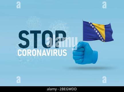 COVID-19 Visual concept - hand-text Stop Coronavirus, hand-gesture versus virus infection, clenched fist holds flag of Bosnia and Hercegovina Stock Photo