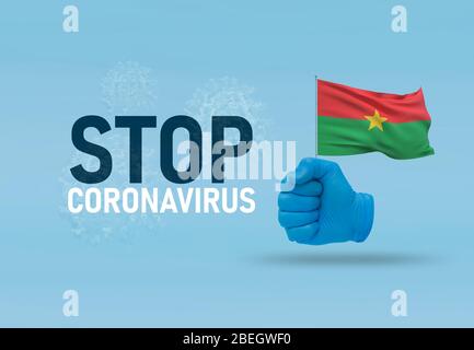 COVID-19 Visual concept - hand-text Stop Coronavirus, hand-gesture versus virus infection, clenched fist holds flag of Burkina Faso. Pandemic 3D Stock Photo