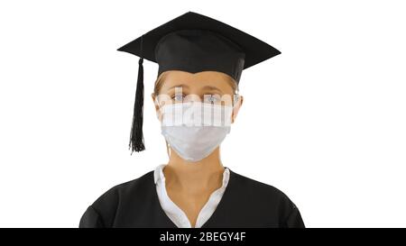 Graduate student lady in a medical mask looking to camera on whi Stock Photo