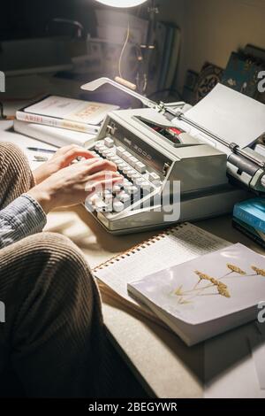 Hands of woman typing on typewriter Stock Photo