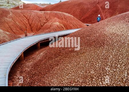 Young woman walking on boardwalk at Painted Hills Stock Photo