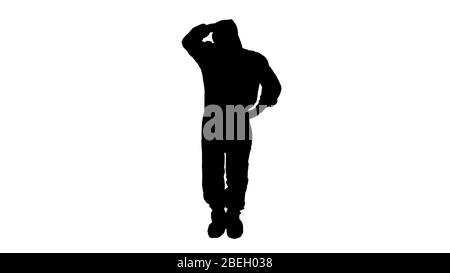 Silhouette Tensed doctor in protective clothes holding his head. Stock Photo