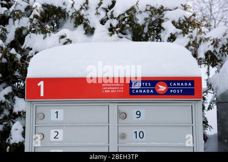 Canada Post communal mailbox after a snowfall. Stock Photo