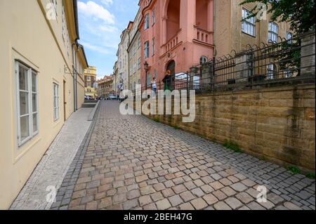 PRAGUE - JULY 20, 2019: View along an old cobbled street Alsovo nabr in Prague Stock Photo