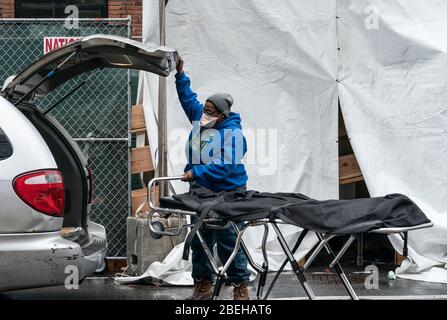 New York, United States. 13th Apr, 2020. Funeral worker prepares for retrieving deceased body for burial amid COVID-19 pandemic at Brooklyn Hospital Center (Photo by Lev Radin/Pacific Press) Credit: Pacific Press Agency/Alamy Live News Stock Photo