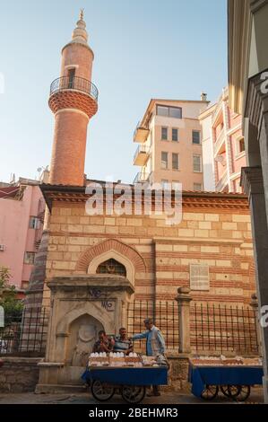 Istanbul, Turkey - August 27, 2013: Street food vendors selling nuts on the street near Bereketzade Mosque in Istanbul Stock Photo