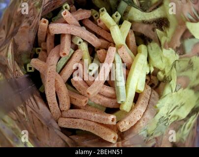 Vegetable straw chips inside the snack bag Stock Photo
