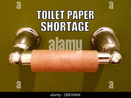 Toilet paper shortage with the empty roll on the holder Stock Photo