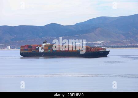 empty cargo  ships moored off shore due to the shutdown of non-essential travel during the 2020 coronavirus pandemic .long beach calfornia,have suspen Stock Photo