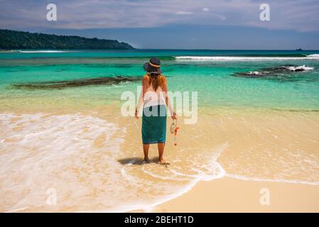 Tourist on the beach with the equipment to snorkeling nt the beach nr 7 at Havelock Island, Stock Photo