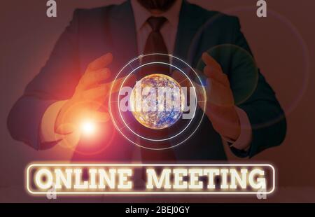Conceptual hand writing showing Online Meeting. Concept meaning a meeting that takes place over an electronic medium Elements of this image furnished Stock Photo