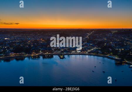 Aerial night view of Puerto Varas city just after sunset, in the Los Lagos district of Chile