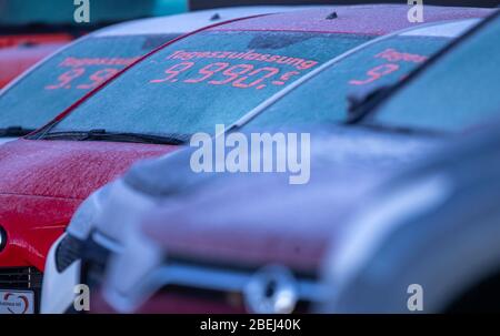 Schwerin, Germany. 14th Apr, 2020. The windscreens of new cars at a car dealership are covered with a layer of ice. In Northern Germany the day begins with temperatures below zero degrees. Credit: Jens Büttner/dpa-Zentralbild/dpa/Alamy Live News Stock Photo