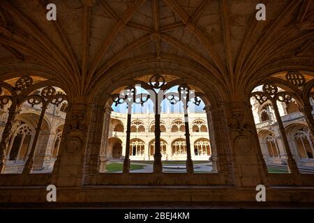 Ornamental and empty cloister and inner courtyard at historic Manueline style Mosteiro dos Jeronimos (Jeronimos Monastery) in Belem, Lisbon, Portugal.