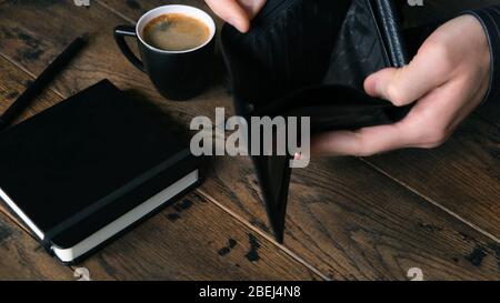Man broke with empty wallet. Male hands open empty wallet, concept of crisis, poverty, bankruptcy Stock Photo