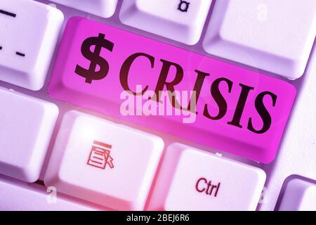 Writing note showing Crisis. Business concept for time when difficult or important decision must be made danger Stock Photo