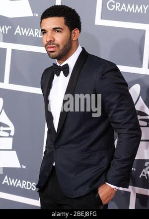 Los Angeles, United States. 14th Apr, 2020. (FILE) Drake Makes Historic Debut at No. 1 on Billboard Hot 100 With 'Toosie Slide'. He becomes the first male act with three No. 1 arrivals, as he scores his seventh total topper. LOS ANGELES, CA, USA - FEBRUARY 10: Rapper Drake wearing Saint Laurent arrives at the 55th Annual GRAMMY Awards held at Staples Center on February 10, 2013 in Los Angeles, California, United States. Credit: Image Press Agency/Alamy Live News Stock Photo